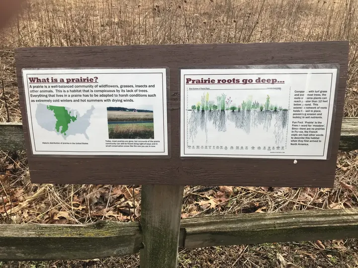 Nature signs on posts outside Sand Ridge Nature Center.