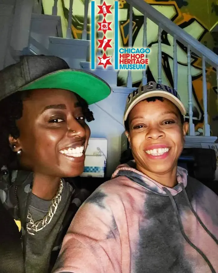 Two women smiling for a selfie at the museum.